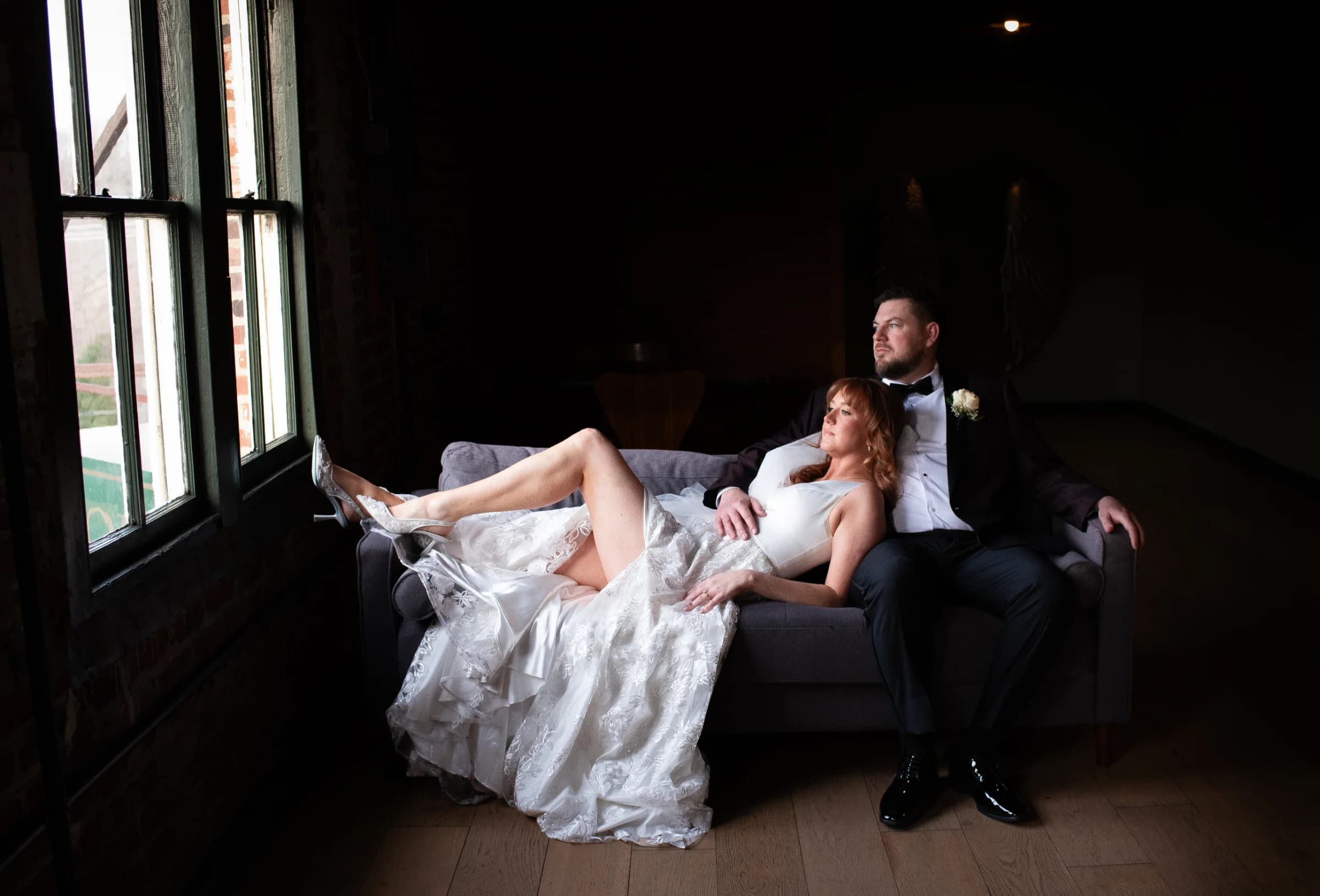 A bride in a delicate veil gazes thoughtfully during an elegant Virginia wedding.